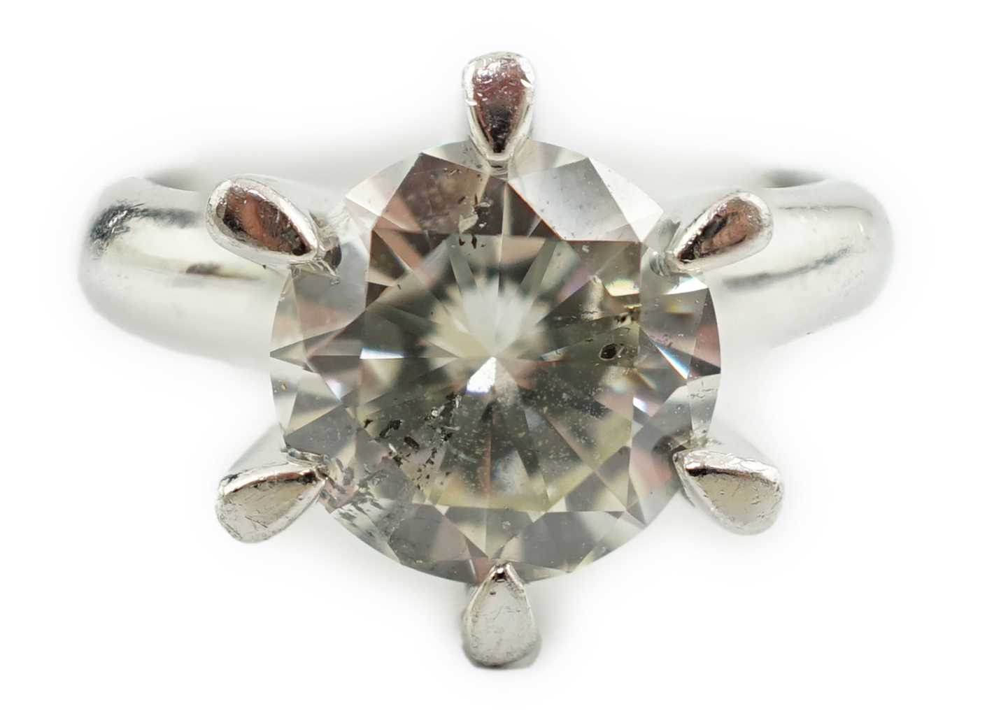 A modern platinum and solitaire diamond set ring
